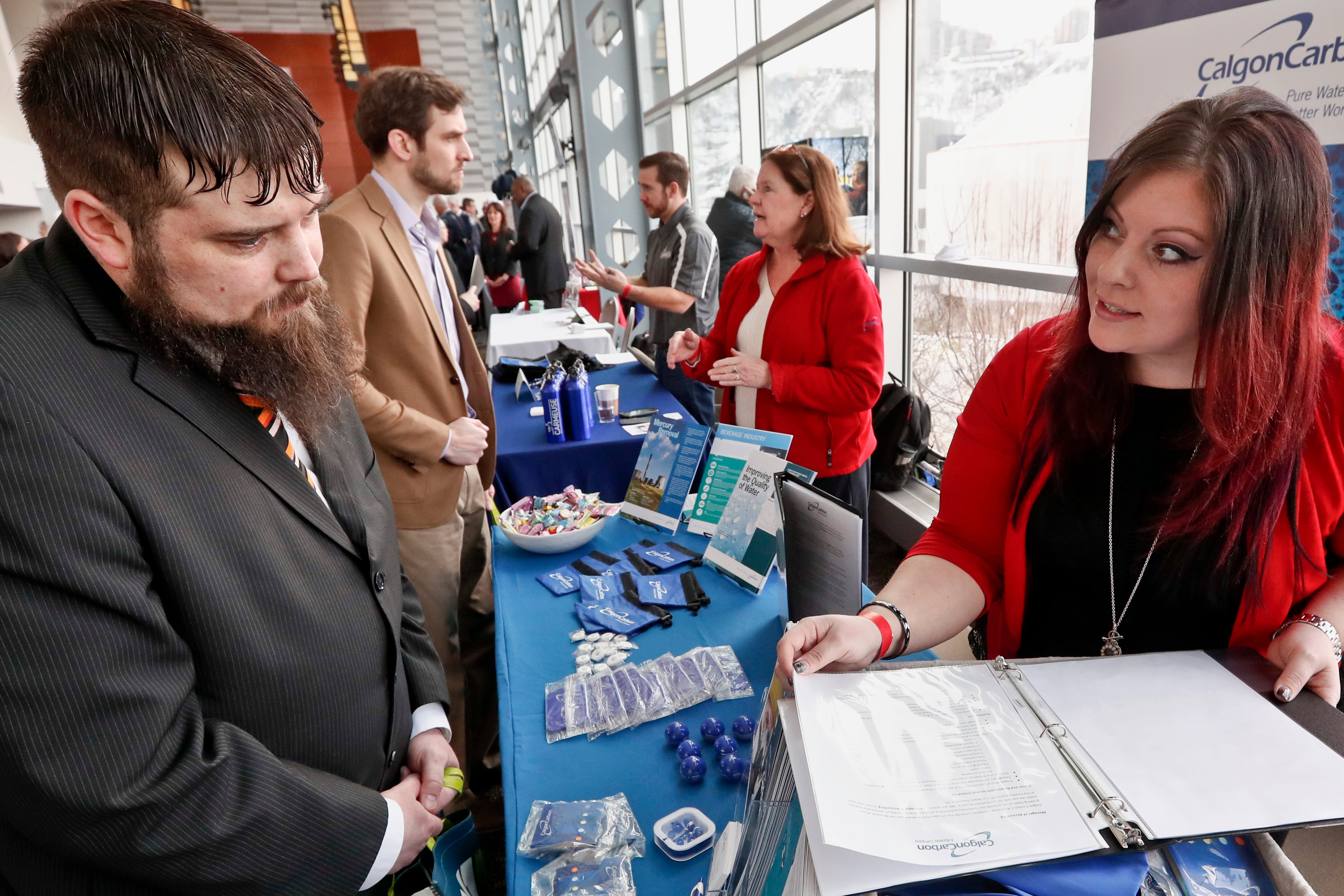 Visitors to the Pittsburgh veterans job fair meet with recruiters at Heinz Field in Pittsburgh on March 7, 2019.