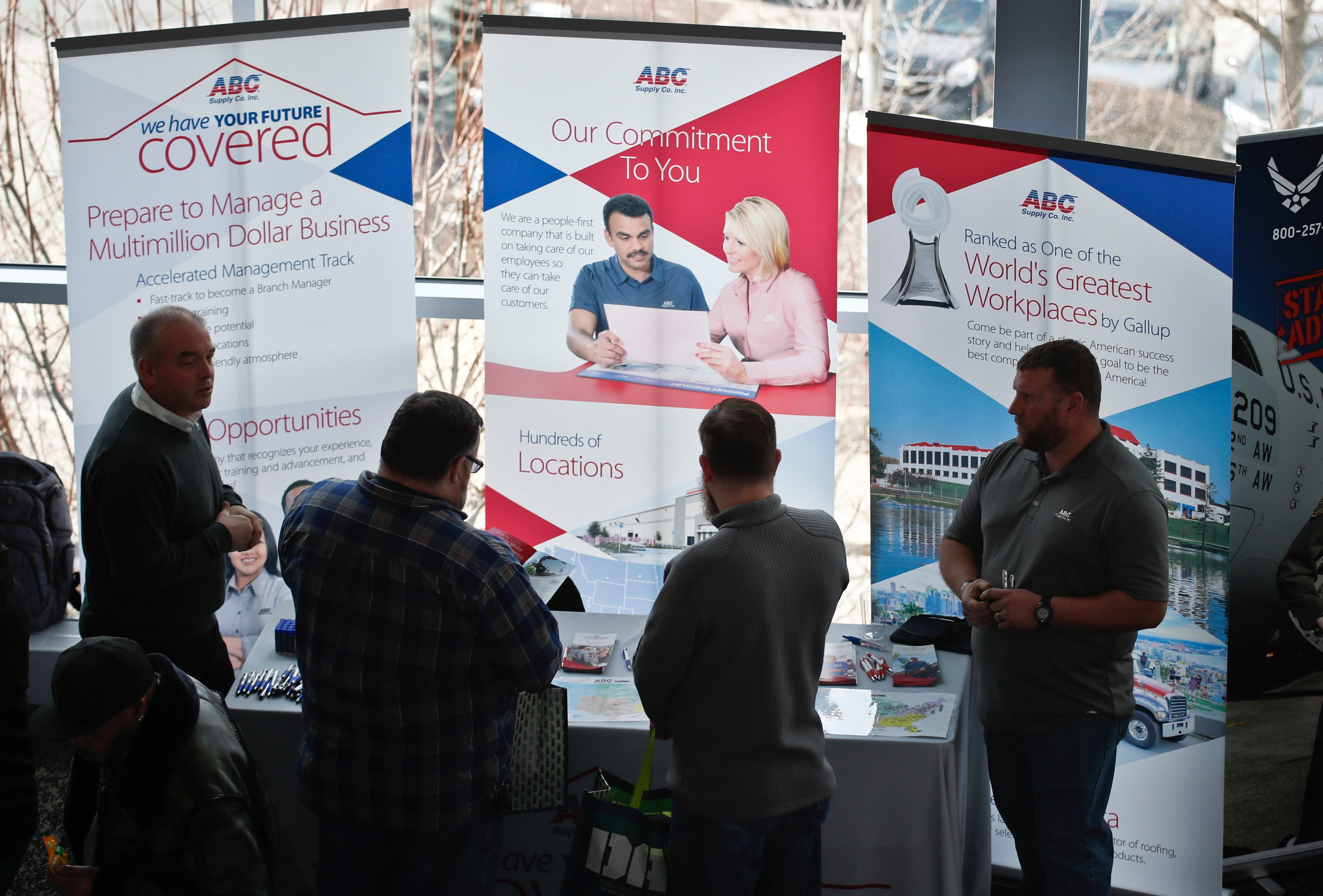 Visitors to the Pittsburgh veterans job fair meet with recruiters at Heinz Field in Pittsburgh on March 7, 2019.