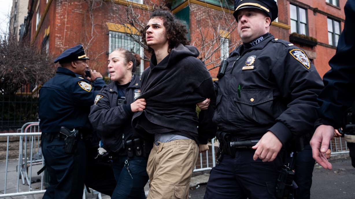 Police detain Emir Balat after he attempted to detonate an improvised explosive device during a counterprotest against far right influencer Jake Lang staging an anti-Islam protest outside Gracie Mansion, Saturday in New York.