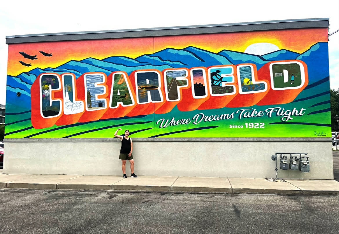 Brooke Facer, a wife, mother and business owner, designed and painted multiple murals for the city of Clearfield during her pregnancy last summer.