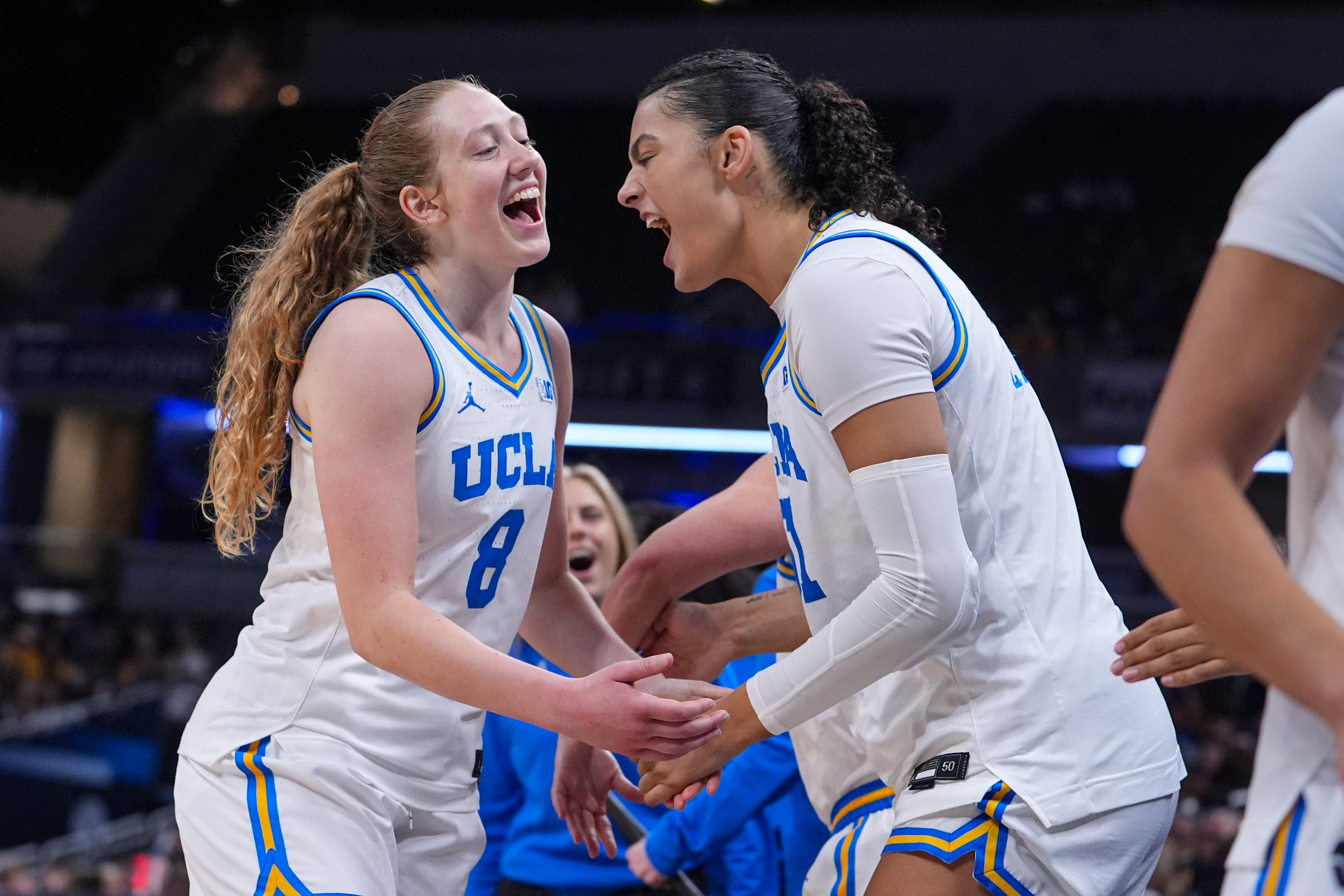 UCLA guard Gianna Kneepkens (8) and center Lauren Betts