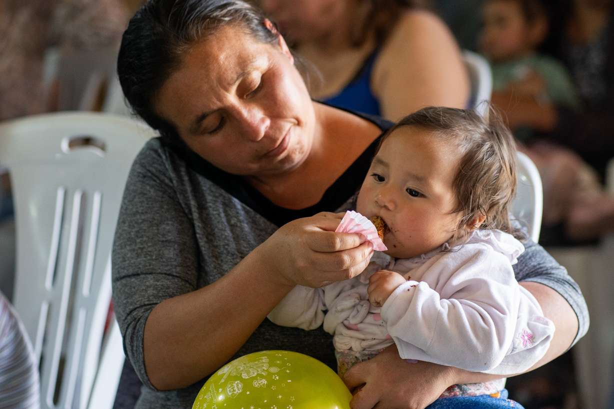 A mother and her child at a nutrition event in Peru. The church released its report detailing 2025 charitable efforts on Tuesday.