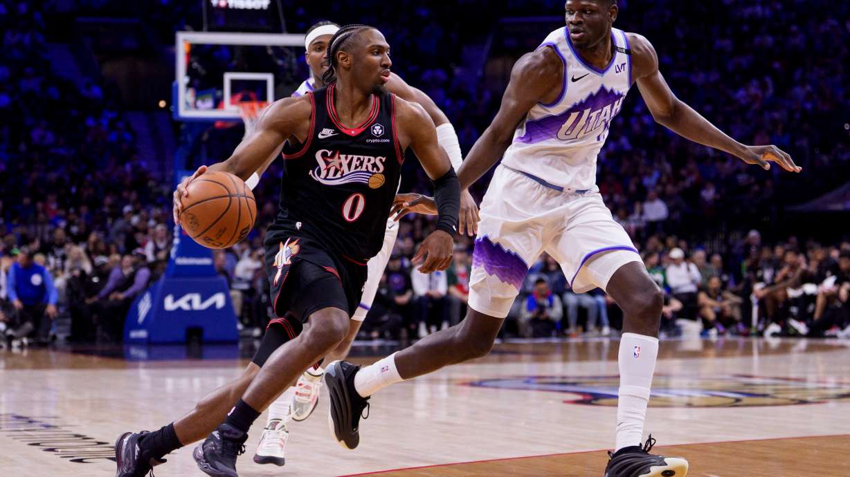 Philadelphia 76ers' Tyrese Maxey, left, drives to the basket against Utah Jazz's Mo Bamba, right, during the first half of an NBA basketball game, Wednesday, March 4, 2026, in Philadelphia.