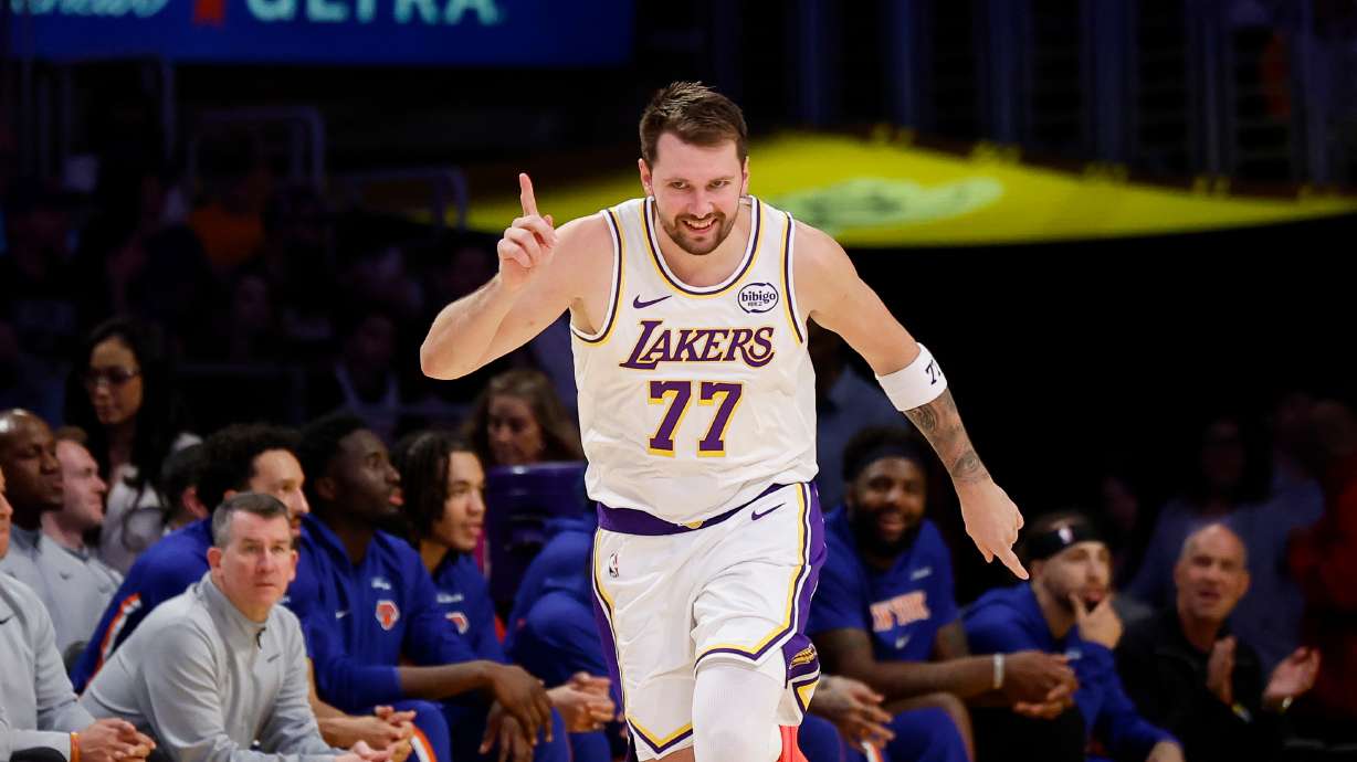 Los Angeles Lakers guard Luka Doncic reacts after scoring during the second half of an NBA basketball game against the New York Knicks, Sunday, March 8, 2026, in Los Angeles.
