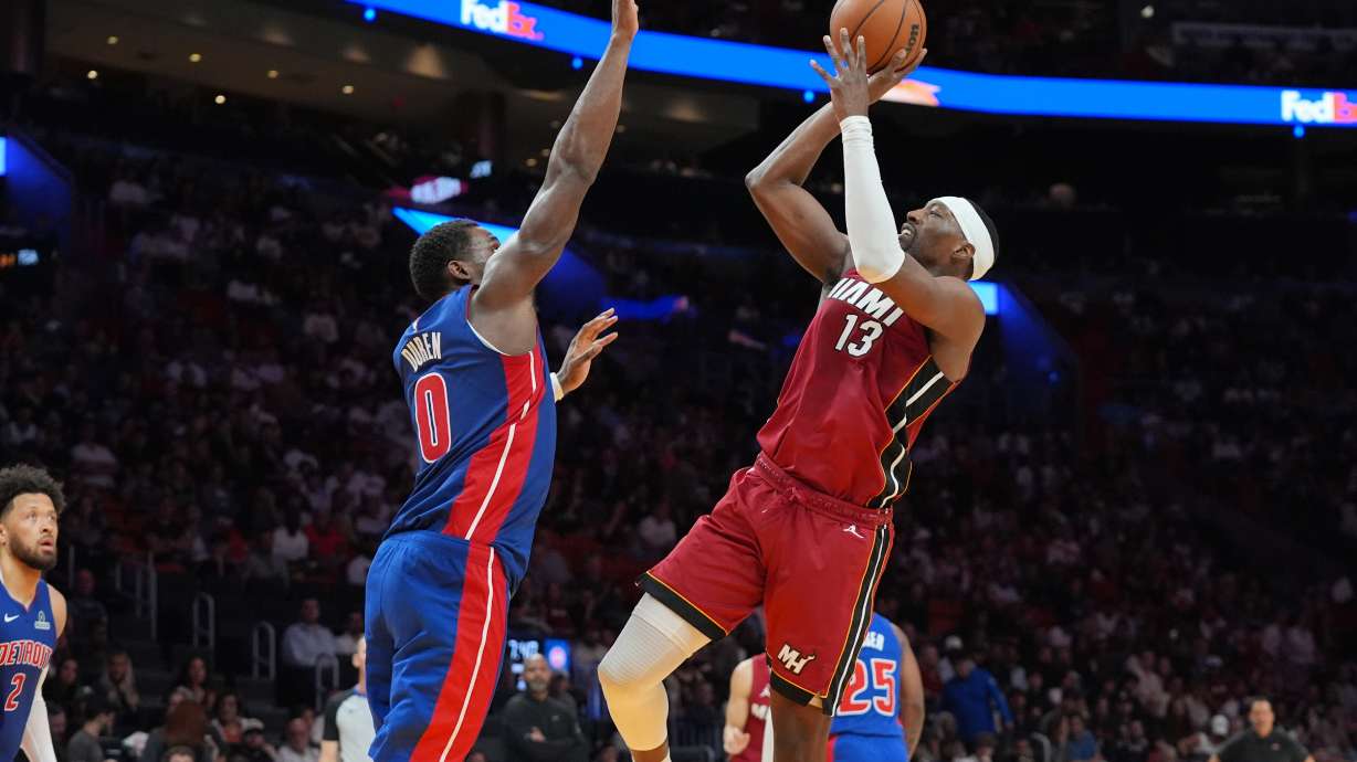 Miami Heat center Bam Adebayo (13) aims to score as Detroit Pistons center Jalen Duren (0) defends during the second half of an NBA basketball game Sunday, March 8, 2026, in Miami.