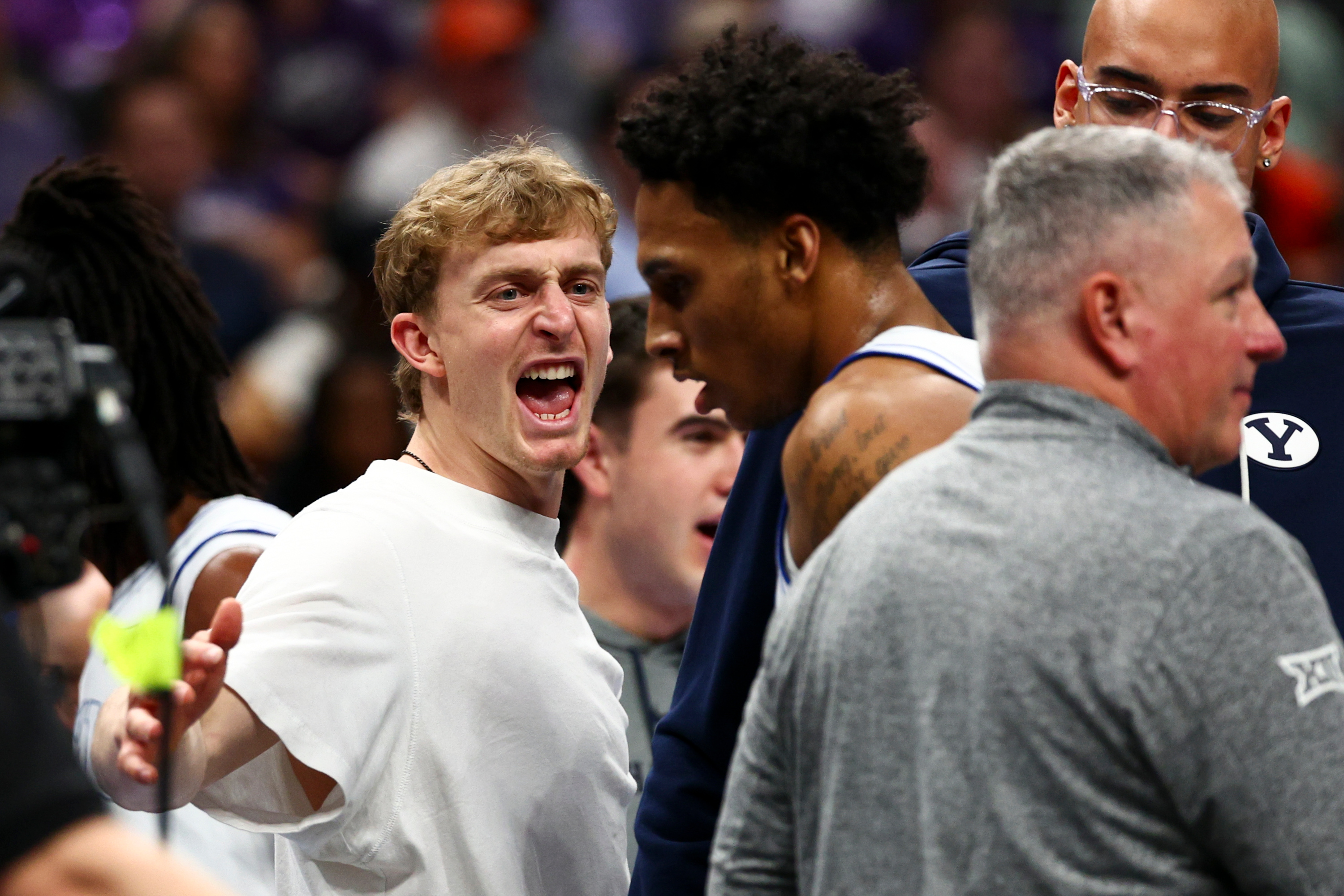 BYU guard Richie Saunders (15) greets teammates at the bench during a timeout during the second half of the game against the Kansas State Wildcats during the 2026 Phillips 66 Big 12 Men's Basketball Tournament at the T-Mobile Center in Kansas City, Missouri, on Tuesday, March 10, 2026.