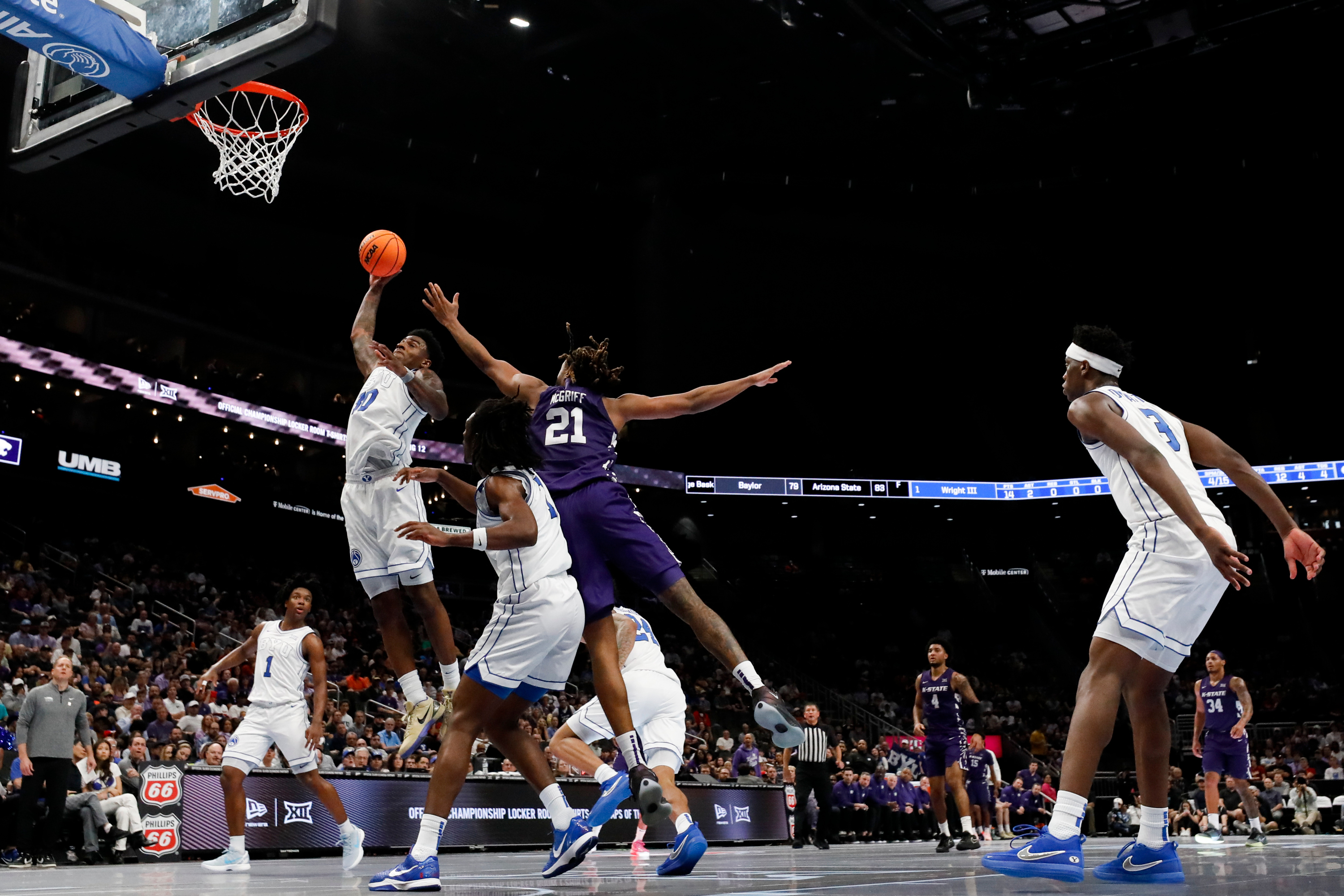 BYU guard Kennard Davis Jr. (30) drives to the basket for a dunk during the second half of the game against the Kansas State Wildcats during the 2026 Phillips 66 Big 12 Men's Basketball Tournament at the T-Mobile Center in Kansas City, Missouri, on Tuesday, March 10, 2026.