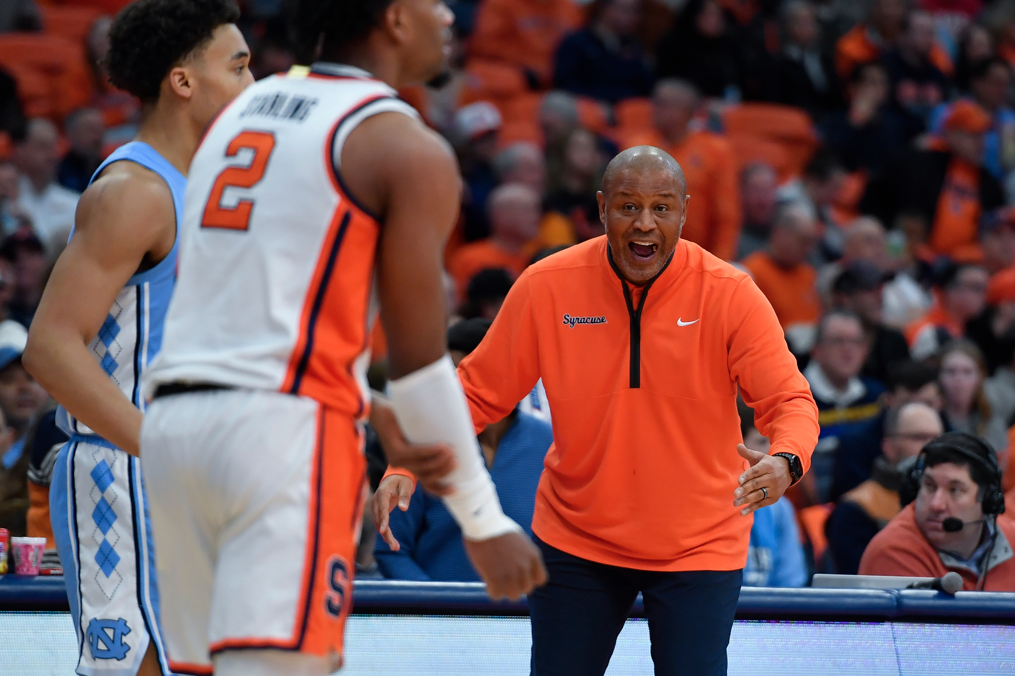 Syracuse head coach Adrian Autry, right, yells instructions to guard J.J. Starling (2) during the first half of an NCAA college basketball game against North Carolina, Saturday, Feb. 21, 2026, in Syracuse, N.Y.