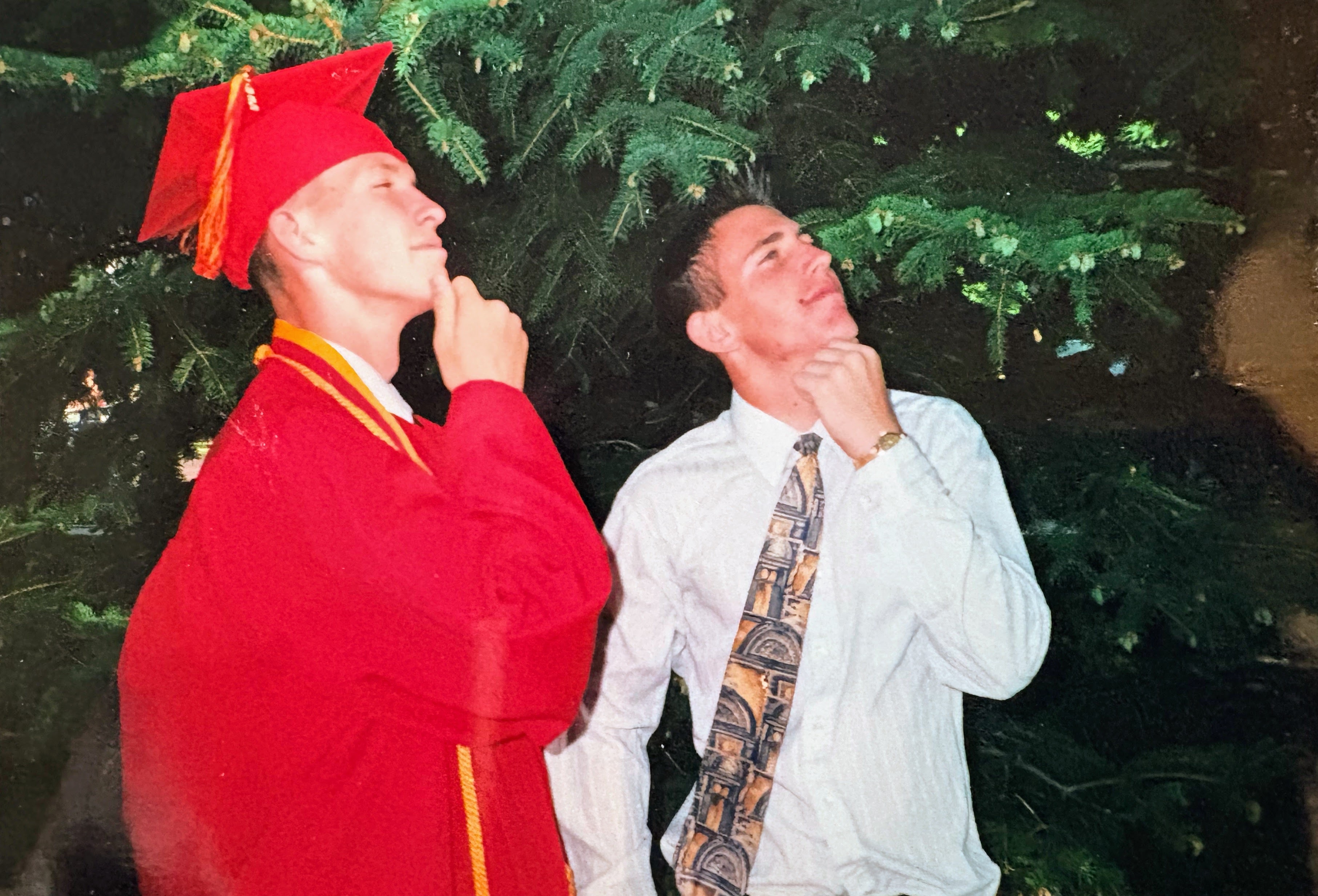 Brothers Jarom Hlebasko (left) and Jake Hlebasko, of Cedar City, at Jarom's high school graduation in 2000. They purchased an innovative seat-cushion company to help others who are wheelchair-bound.
