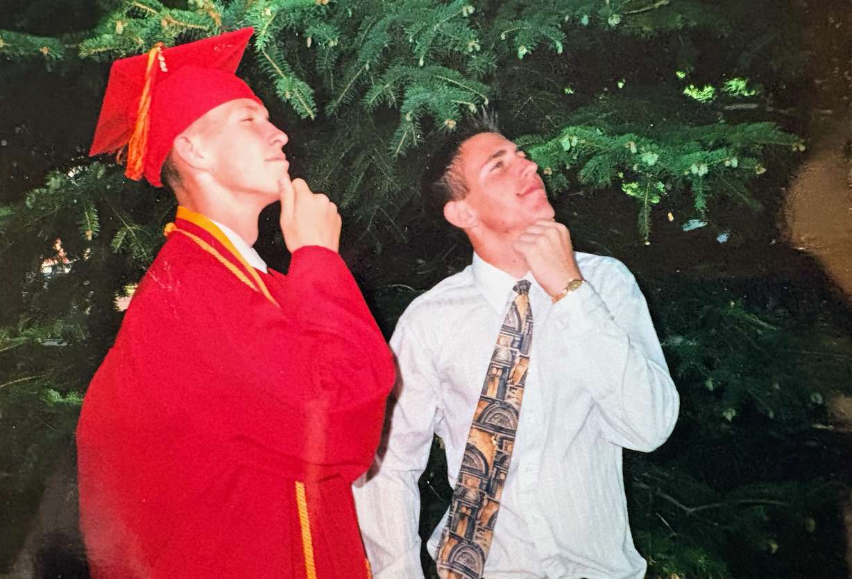 Brothers Jarom Hlebasko (left) and Jake Hlebasko, of Cedar City, at Jarom's high school graduation in 2000. They purchased an innovative seat-cushion company to help others who are wheelchair-bound.