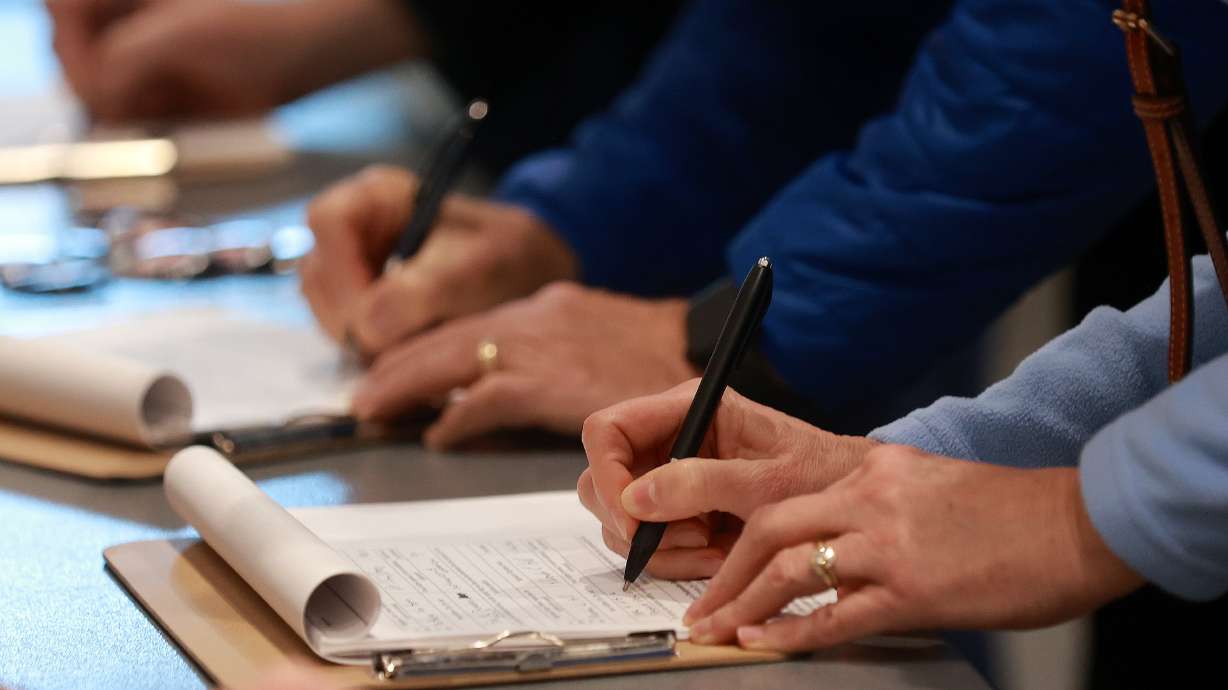 People sign to repeal Proposition 4 at the Roy Library in Roy on Jan. 16, 2026. The law at the center of Utah's redistricting chaos is on track to appear on the November ballot.