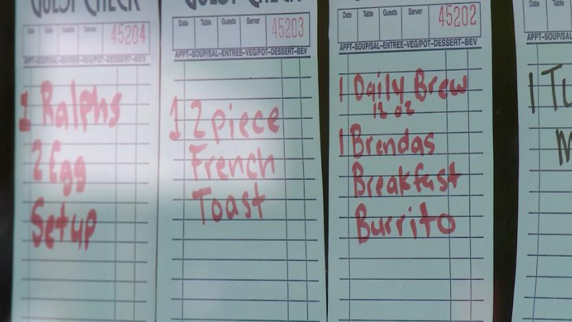 Meal tickets are left by customers for others in need at Cafe Villa Bella in Ogden, in May, 2020.