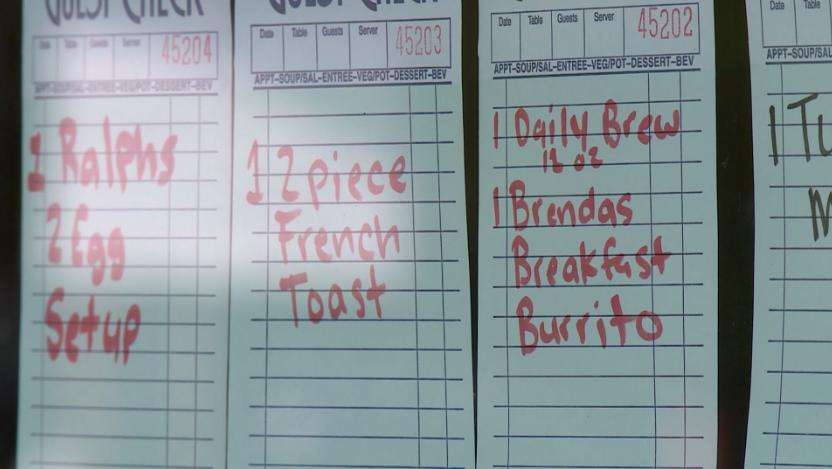 Meal tickets are left by customers for others in need at Cafe Villa Bella in Ogden, in May, 2020.
