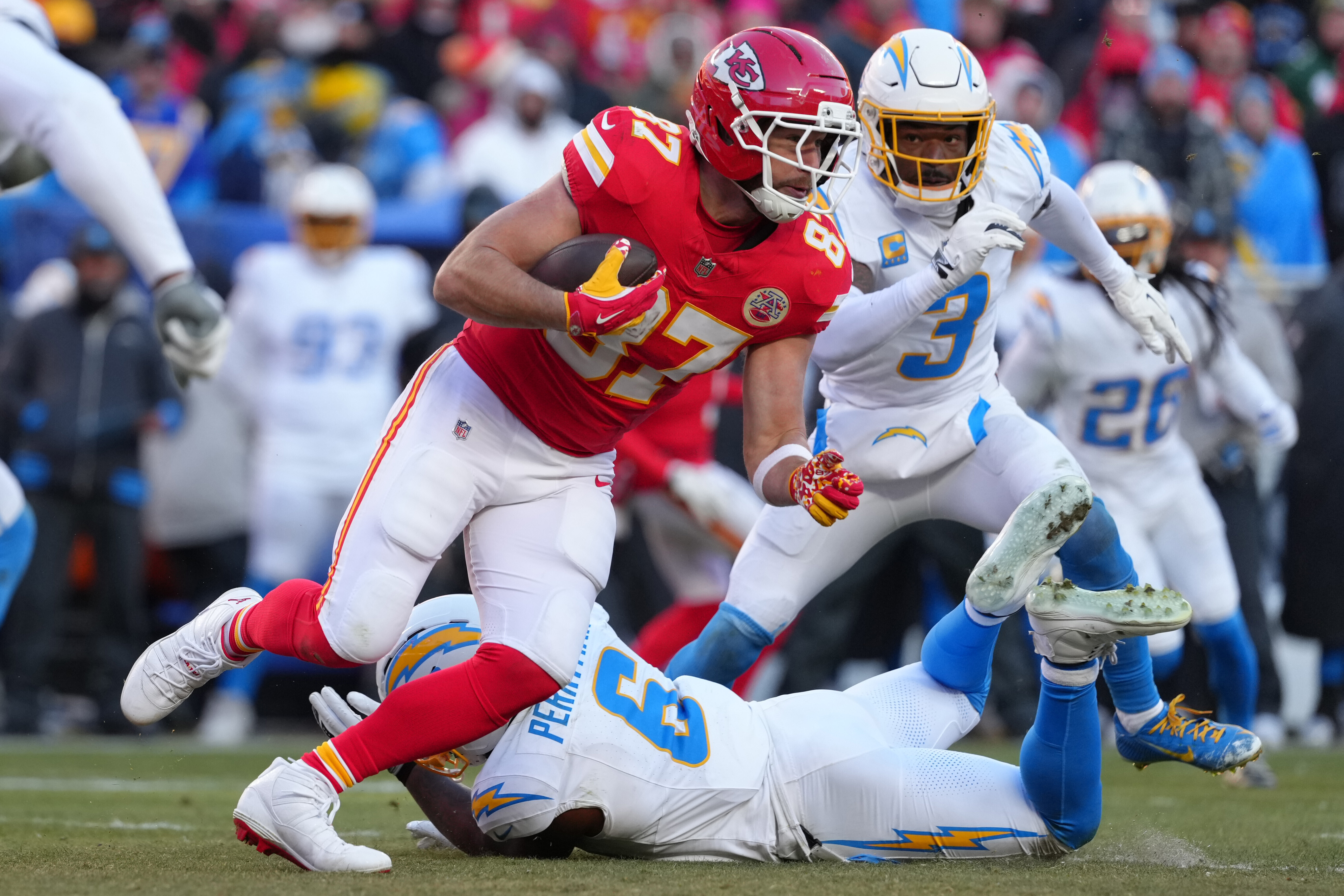 FILE - Kansas City Chiefs tight end Travis Kelce catches a pass against the Los Angeles Chargers during an NFL football game, Dec, 14, 2025, in Kansas City, Mo.