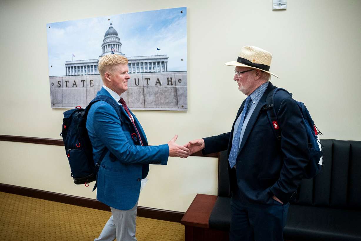 Rep. Jon Hawkins, left, R-Pleasant Grove, chair of the Utah state Legislature’s Olympic and Paralympic Winter Games Coordination Committee, shakes hands with Tom Kelly, communications lead for the Salt Lake City-Utah Committee for the Games, after a meeting between the two committees held in the Senate Building of the Capitol in Salt Lake City on Aug. 14, 2025.