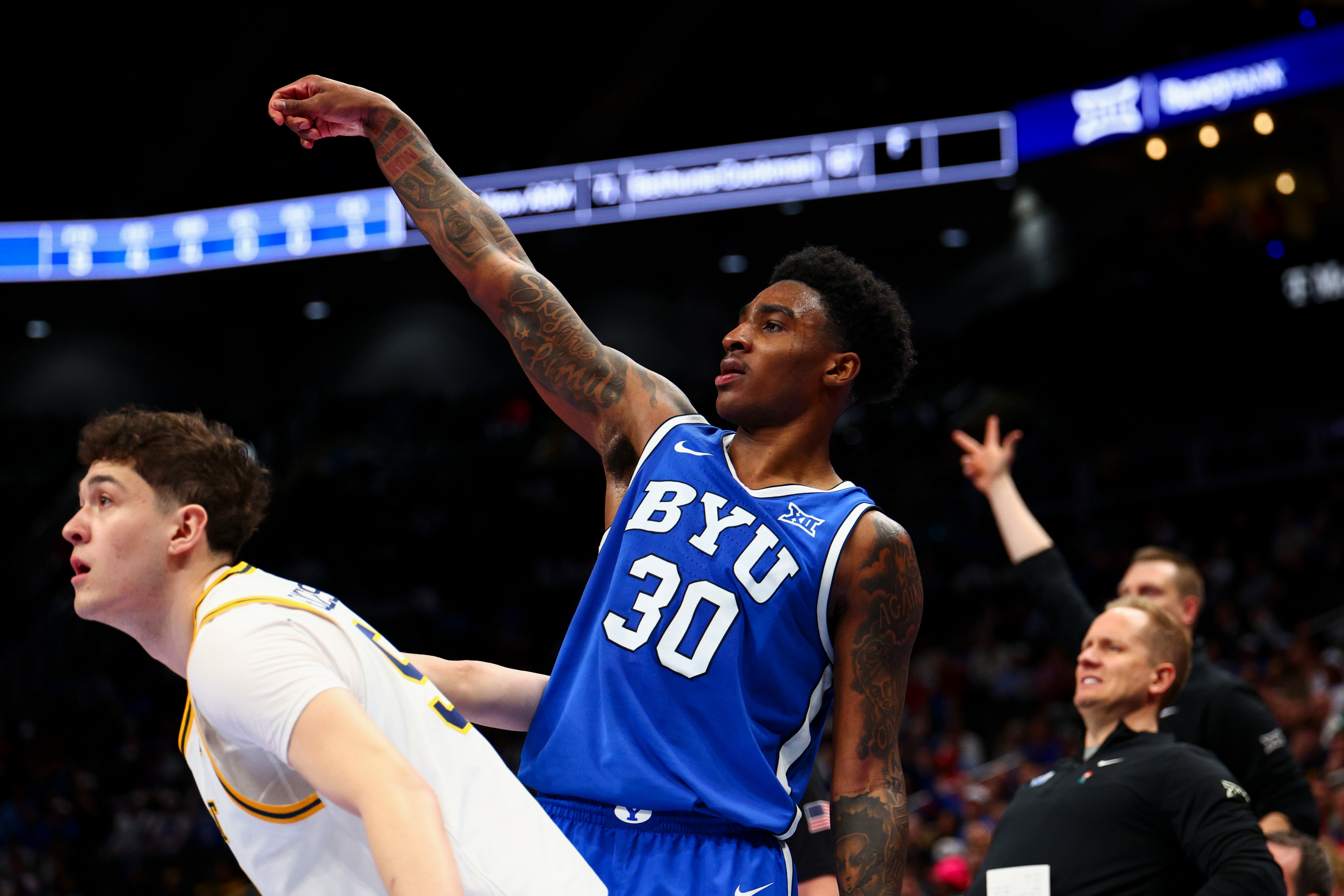 BYU guard Kennard Davis Jr. (30) watches his 3-pointer fly during the second half of the game against the West Virginia Mountaineers in the second round of the 2026 Phillips 66 Big 12 Men's Basketball Tournament at the T-Mobile Center in Kansas City, Mo., on Wednesday, March 11, 2026.