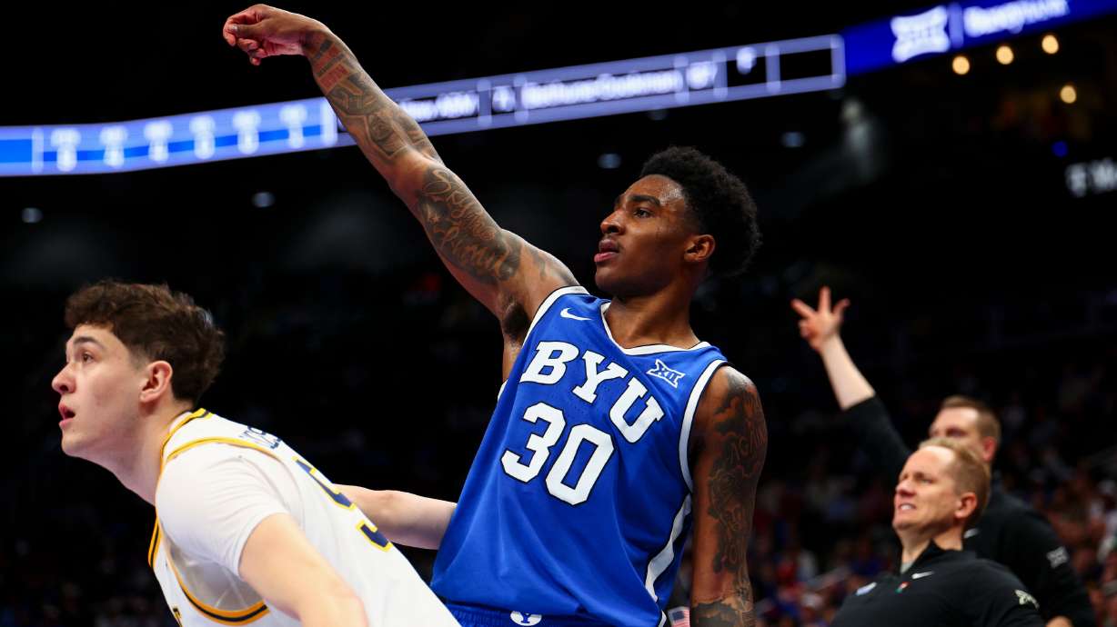 BYU guard Kennard Davis Jr. (30) watches his 3-pointer fly during the second half of the game against the West Virginia Mountaineers in the second round of the 2026 Phillips 66 Big 12 Men's Basketball Tournament at the T-Mobile Center in Kansas City, Mo., on Wednesday, March 11, 2026.