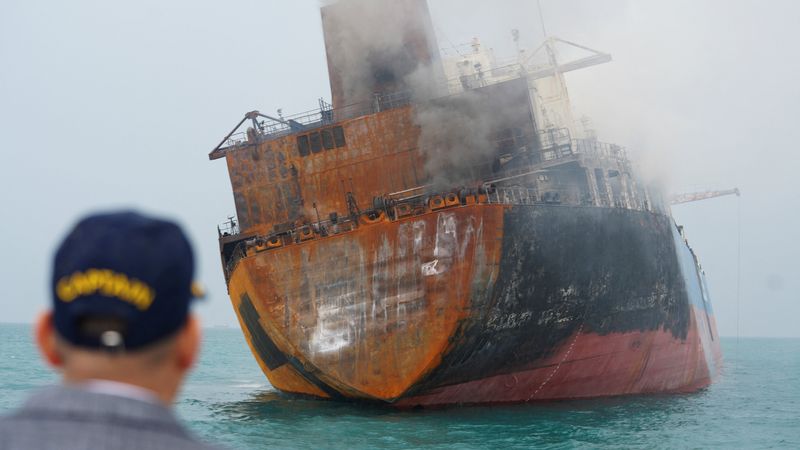 A foreign tanker carrying Iraqi fuel oil was damaged after catching fire in Iraq's territorial waters, following unidentified attacks that targeted two foreign tankers, according to Iraqi port officials, near Basra, Iraq, Thursday.