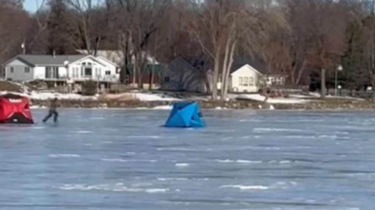 Winds blow a portable shelter across the ice at Lake Puckaway, Wisconsin, on Dec. 20, 2025.