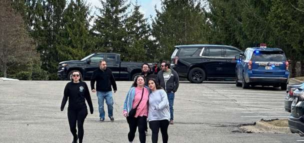 Armed man rammed vehicle into Michigan synagogue and was fatally shot by security, AP says