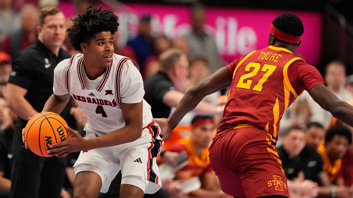 Texas Tech's Christian Anderson (4) looks to pass round Iowa State's Killyan Toure (27) during the first half of an NCAA college basketball game in the quarterfinal round of the Big 12 Conference tournament Thursday, March 12, 2026, in Kansas City, Mo.