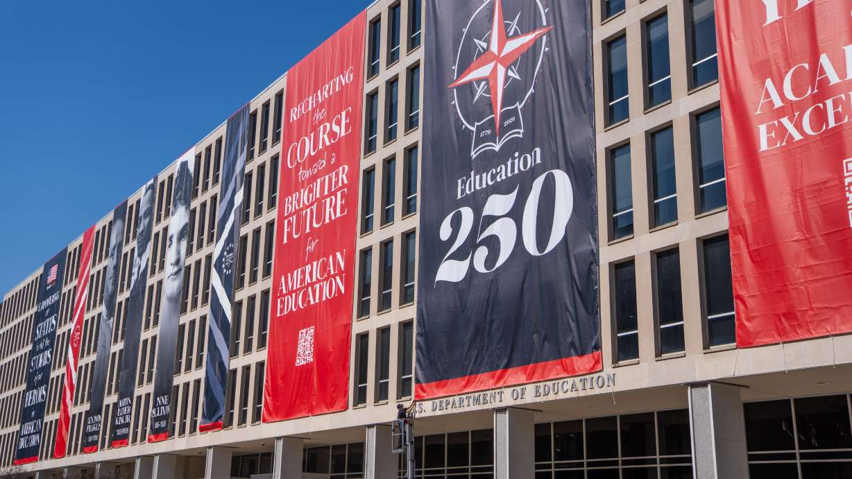 Banners hang from the Department of Education, March 1 in Washington. A Trump administration directive designed to ensure that U.S. colleges and universities receiving federal assistance are not considering race in admissions is heading to the courts.