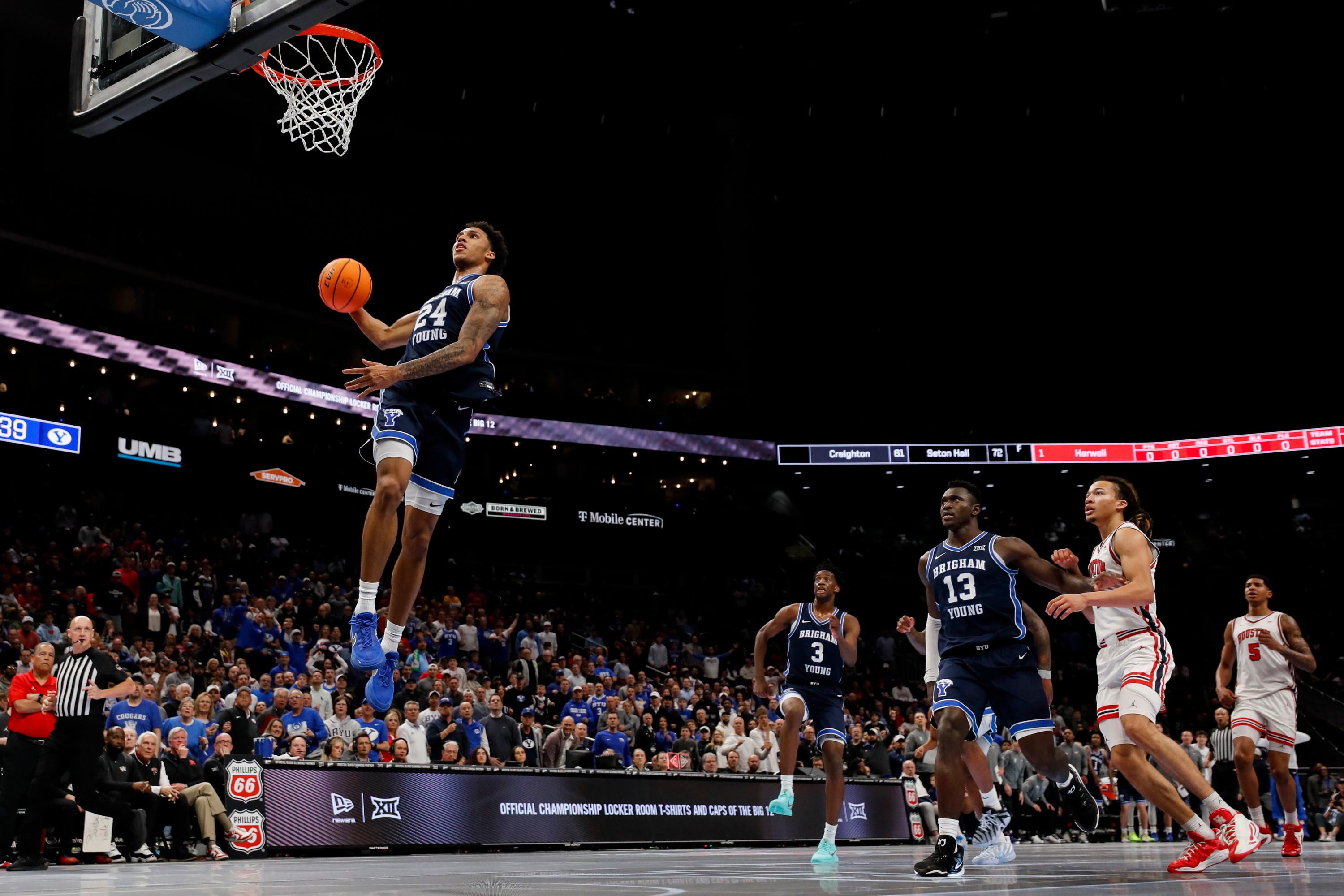 BYU forward Dominique Diomande (24) dunks during the first half of the game against the Houston Cougars during the quarterfinal of the 2026 Phillips 66 Big 12 Men's Basketball Tournament at the T-Mobile Center in Kansas City, Missouri, on Thursday, March 12, 2026.