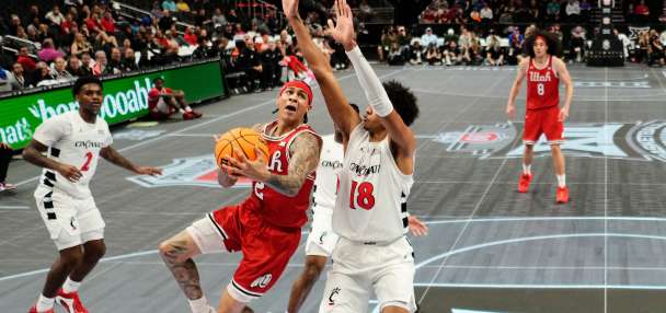 Big 12 ditching slippery glass floor for hardwood for rest of tournament