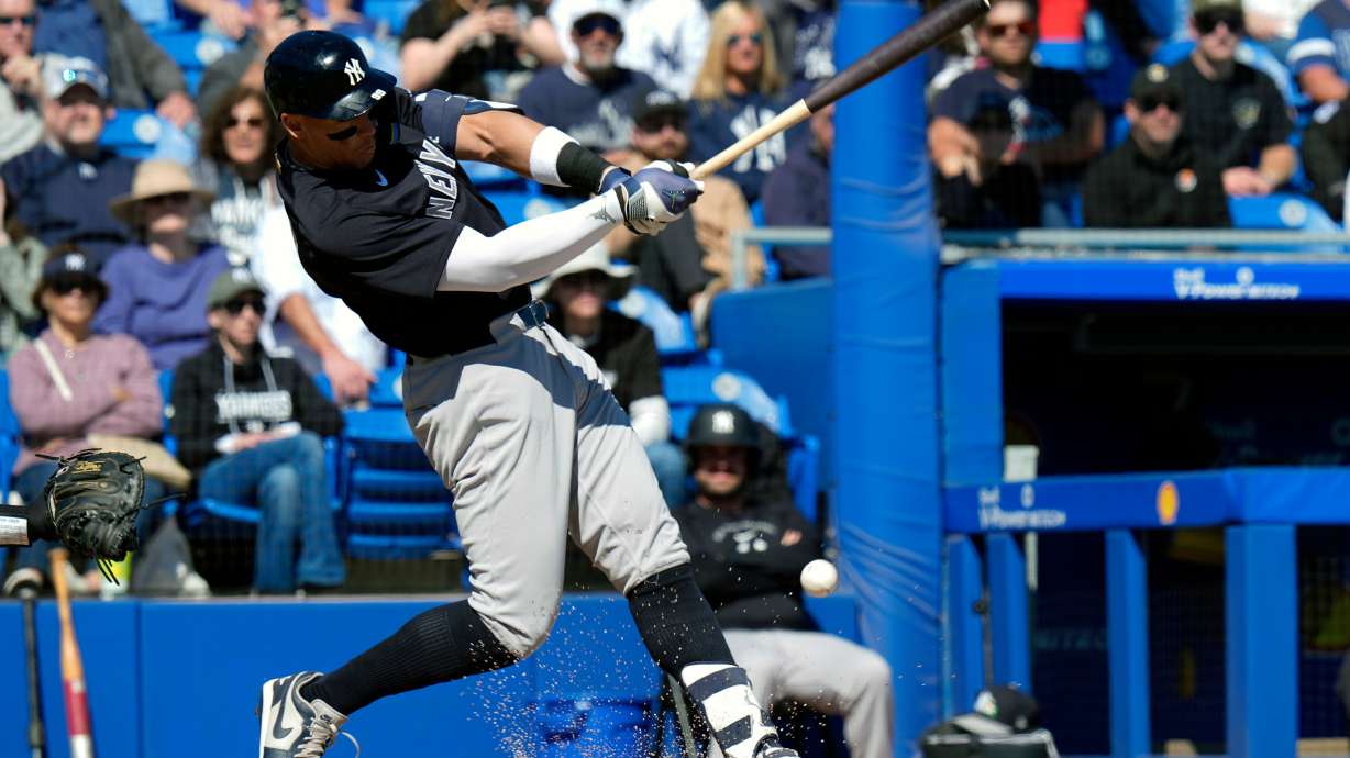 New York Yankees' Aaron Judge connects for a single off Toronto Blue Jays pitcher Jesse Hahn during the fifth inning of a spring training baseball game Tuesday, Feb. 24, 2026, in Dunedin, Fla.