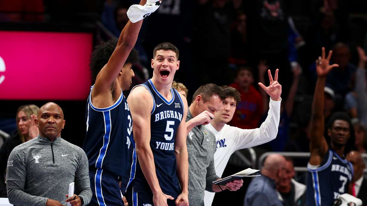 BYU forward Mihailo Boskovic (5) reacts after a 3-pointer during the first half of the game against the Houston Cougars during the quarterfinal of the 2026 Phillips 66 Big 12 Men's Basketball Tournament at the T-Mobile Center in Kansas City, Missouri, on Thursday, March 12, 2026.