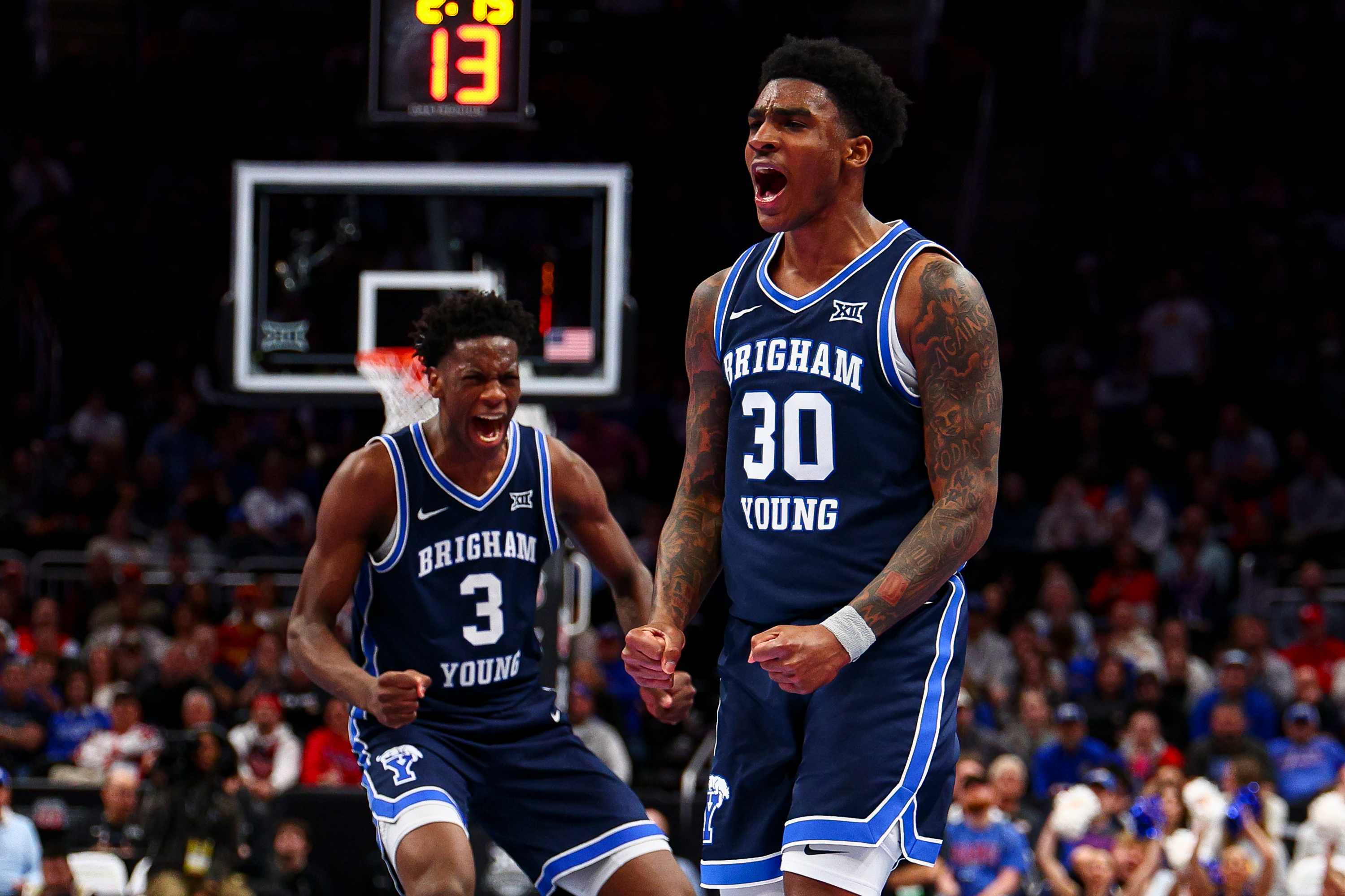 BYU guard Kennard Davis Jr. (30) and forward AJ Dybantsa (3) celebrate after a basket during the first half of the game against the Houston Cougars during the quarterfinal of the 2026 Phillips 66 Big 12 Men's Basketball Tournament at the T-Mobile Center in Kansas City, Missouri, on Thursday, March 12, 2026.