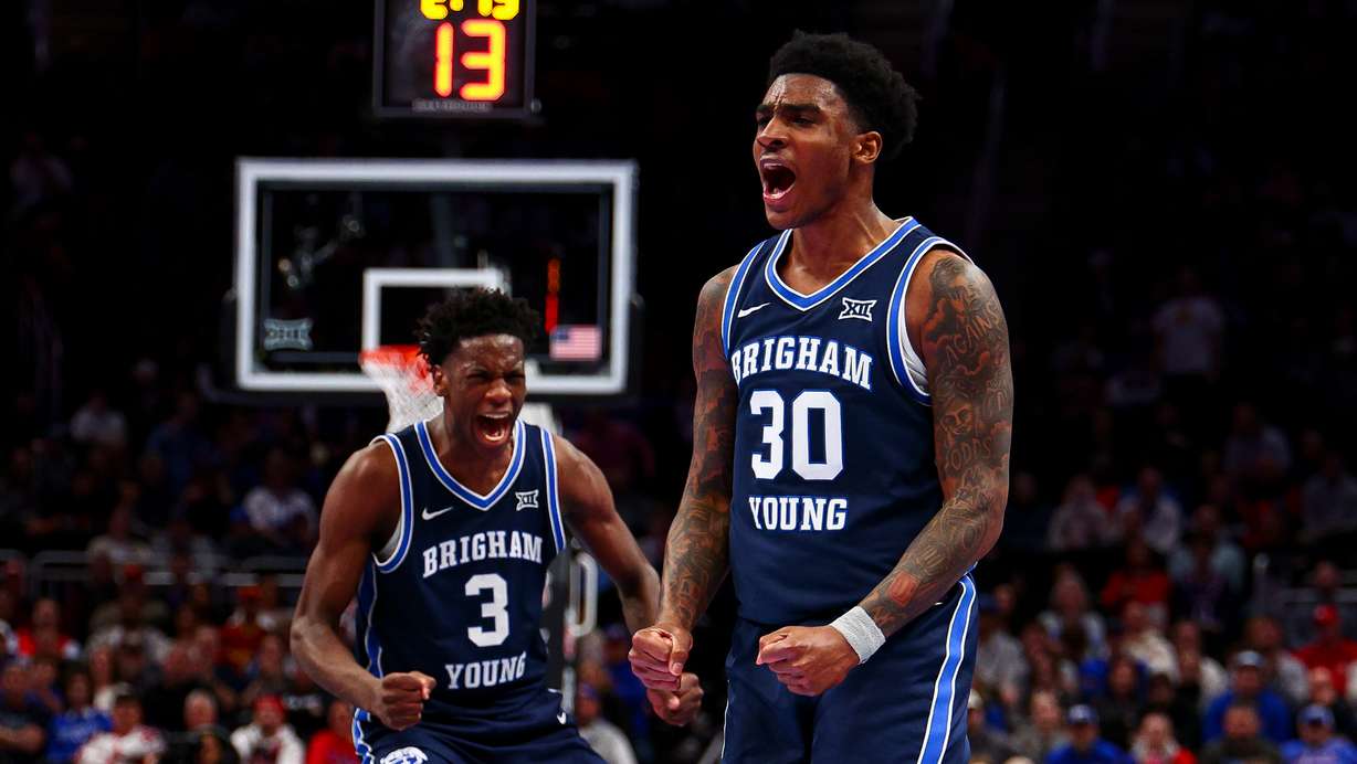 BYU guard Kennard Davis Jr. (30) and forward AJ Dybantsa (3) celebrate after a basket during the first half of the game against the Houston Cougars during the quarterfinal of the 2026 Phillips 66 Big 12 Men's Basketball Tournament at the T-Mobile Center in Kansas City, Missouri, on Thursday, March 12, 2026.