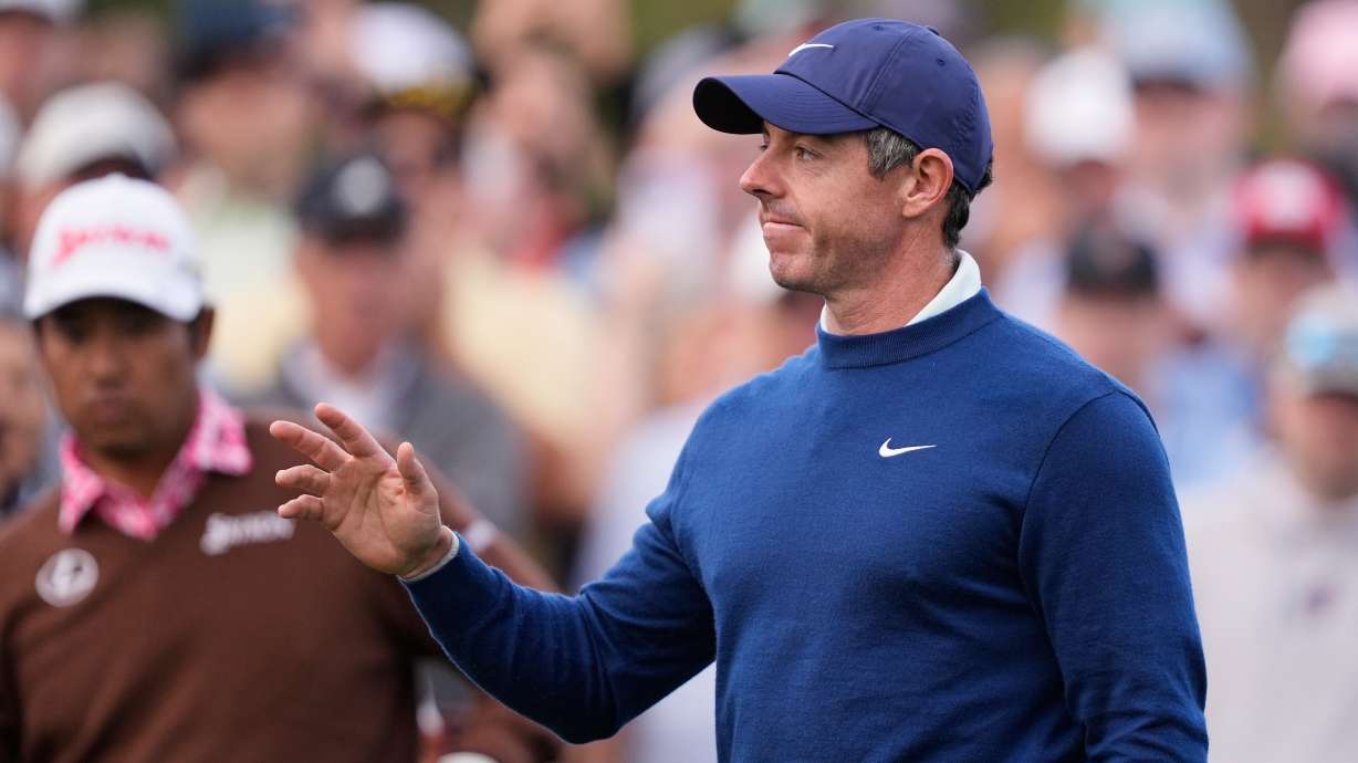 Rory McIlroy of Northern Ireland acknowledges fans appluase before hitting off the 10th tee during the second round of The Players Championship golf tournament Friday, March 13, 2026, in Ponte Vedra Beach, Fla.