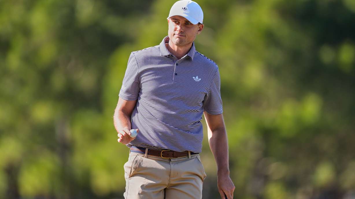 Ludvig Aberg of Sweden acknowledges applause from the gallery after sinking his putt on the 11th green during the second round of The Players Championship golf tournament Friday, March 13, 2026, in Ponte Vedra Beach, Fla.