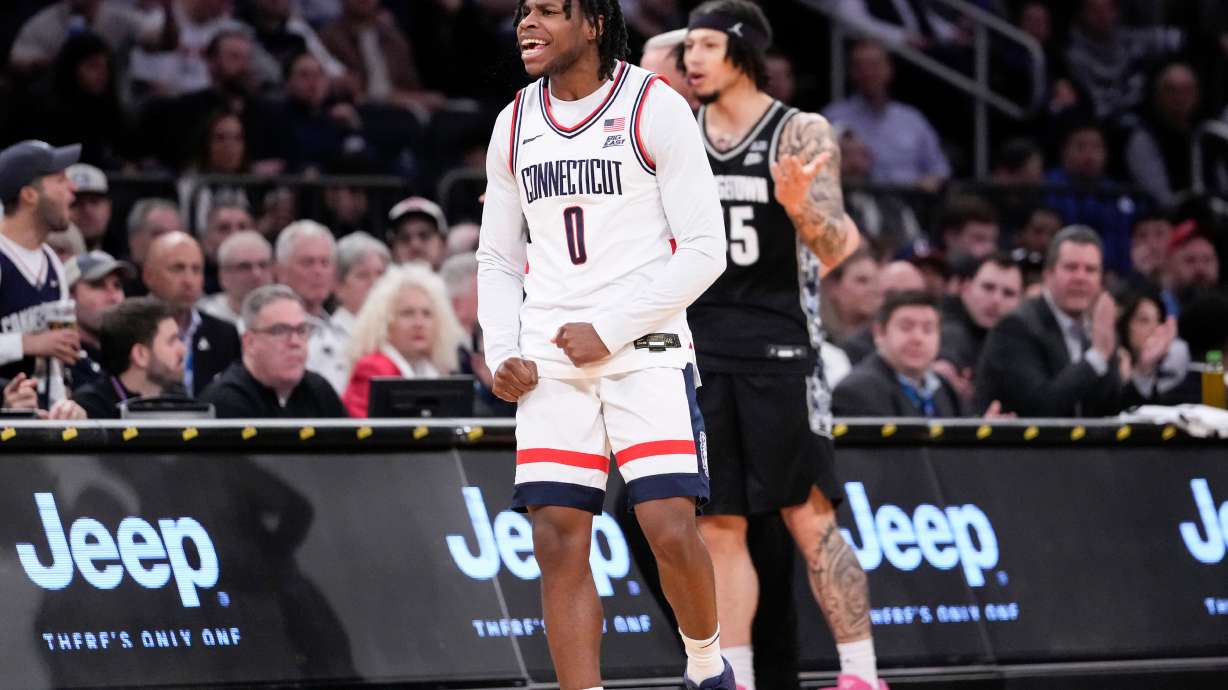 UConn guard Malachi Smith (0) reacts after stealing the ball during the first half of an NCAA college basketball game against Georgetown in the semifinals of the Big East tournament, Friday, March 13, 2026, in New York.
