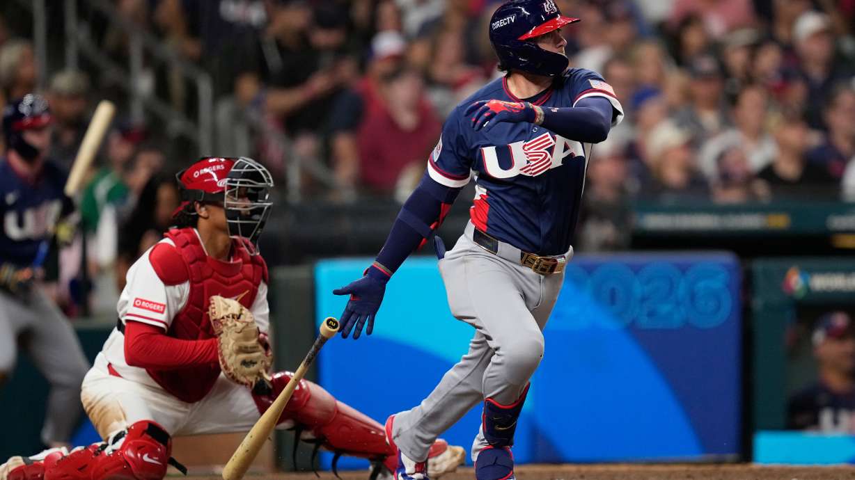 United States second baseman Brice Turang (13) hits an RBI single against Canada during the sixth inning of a World Baseball Classic quarterfinal game, Friday, March 13, 2026, in Houston.