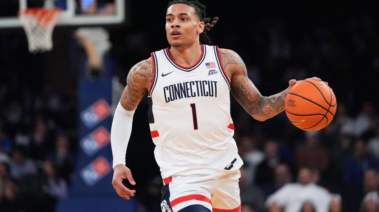 UConn's Solo Ball (1) looks to pass during first half of an NCAA college basketball game against Xavier in the quarterfinals of the Big East basketball tournament Thursday, March 12, 2026, in New York.