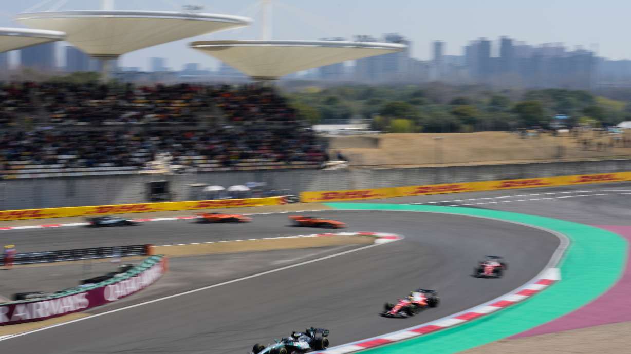 Mercedes driver George Russell, left, of Britain leads the pack during the Sprint Race of the Chinese Formula One Grand Prix at the Shanghai International Circuit, in Shanghai, China, Saturday, March 14, 2026.