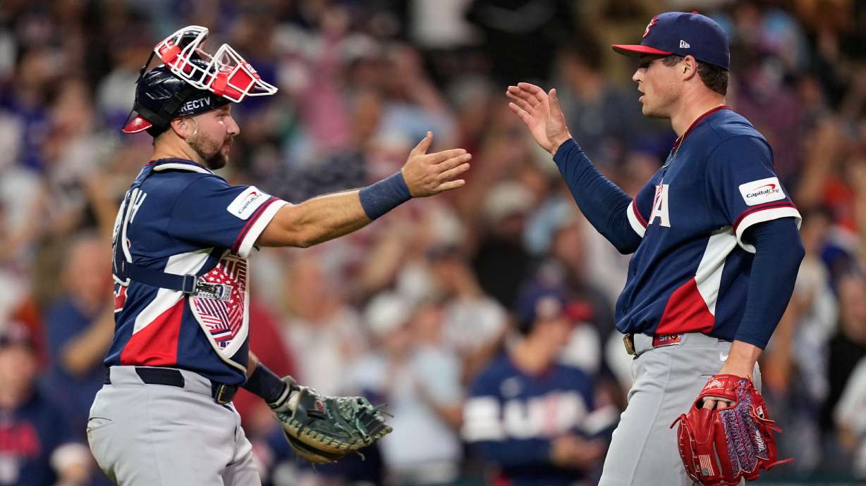 United States catcher Cal Raleigh, left, and pitcher Mason Miller, right, celebrate after their win over Canada in a World Baseball Classic quarterfinal game, Friday, March 13, 2026, in Houston.