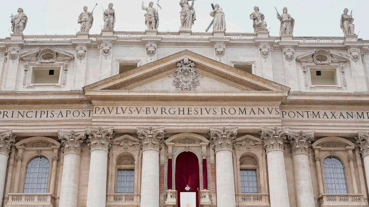 Pope Leo XIV appears at the central balcony of St. Peter's Basilica for his first Sunday blessing after his election, in St. Peter's Square at the Vatican, on May 11, 2025.