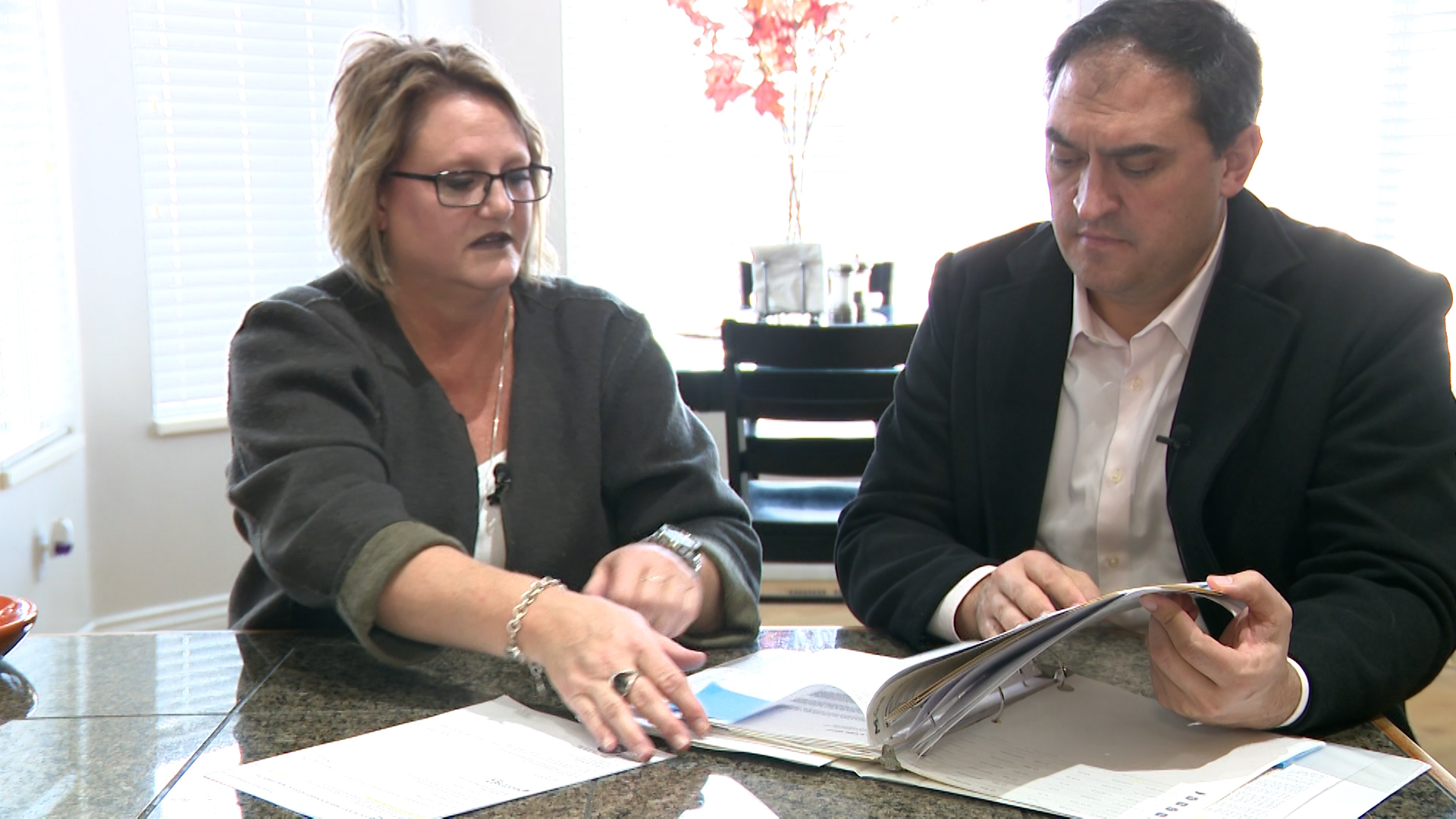 Tawnya Scheele shows KSL’s Matt Gephardt how two different claims have the same medical codes, dates, and prices.