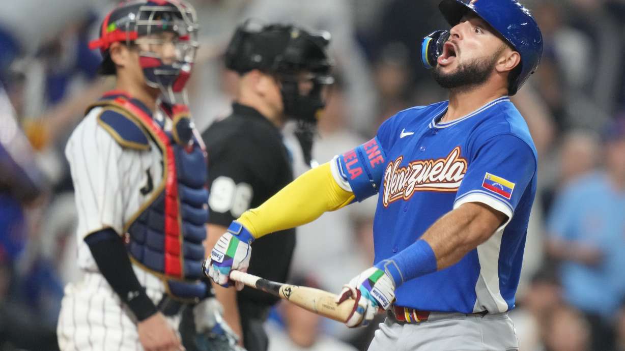 Venezuela's Wilyer Abreu celebrates with his teammates after he hit a home run during the six inning of a World Baseball Classic quarterfinal game against Japan, Saturday, March 14, 2026, in Miami.