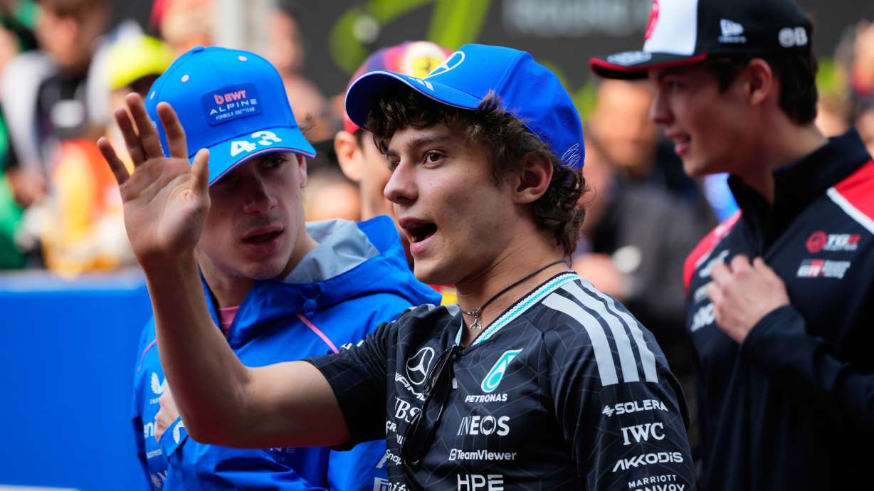 Mercedes driver Andrea Kimi Antonelli of Italy gestures during the drivers parade ahead of the Chinese Formula One Grand Prix race at the Shanghai International Circuit, in Shanghai, China, Sunday, March 15, 2026.
