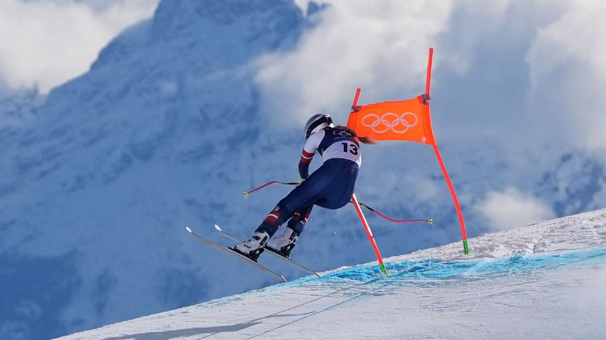 FILE - United States' Lindsey Vonn crashes into a gate during an alpine skiing women's downhill race, at the Winter Olympics, in Cortina d'Ampezzo, Italy, Feb. 8, 2026.