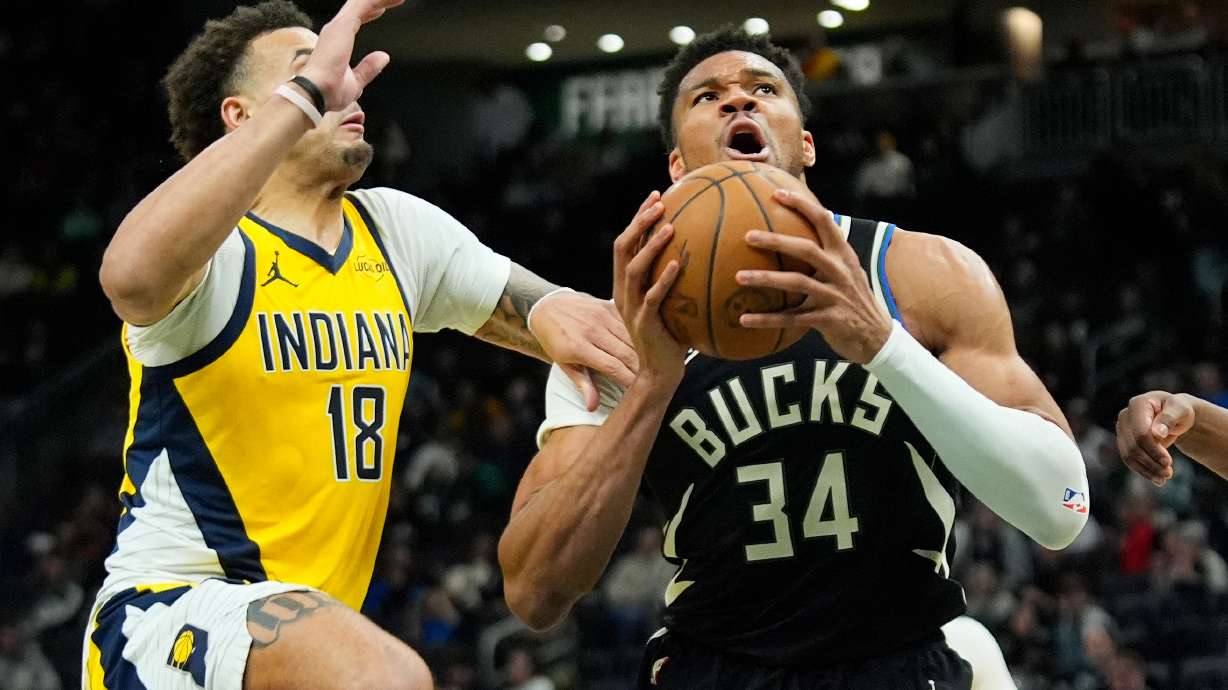 Milwaukee Bucks' Giannis Antetokounmpo (34) drives to the basket against Indiana Pacers' Jalen Slawson (18) during the second half of an NBA basketball game, Sunday, March 15, 2026, in Milwaukee.
