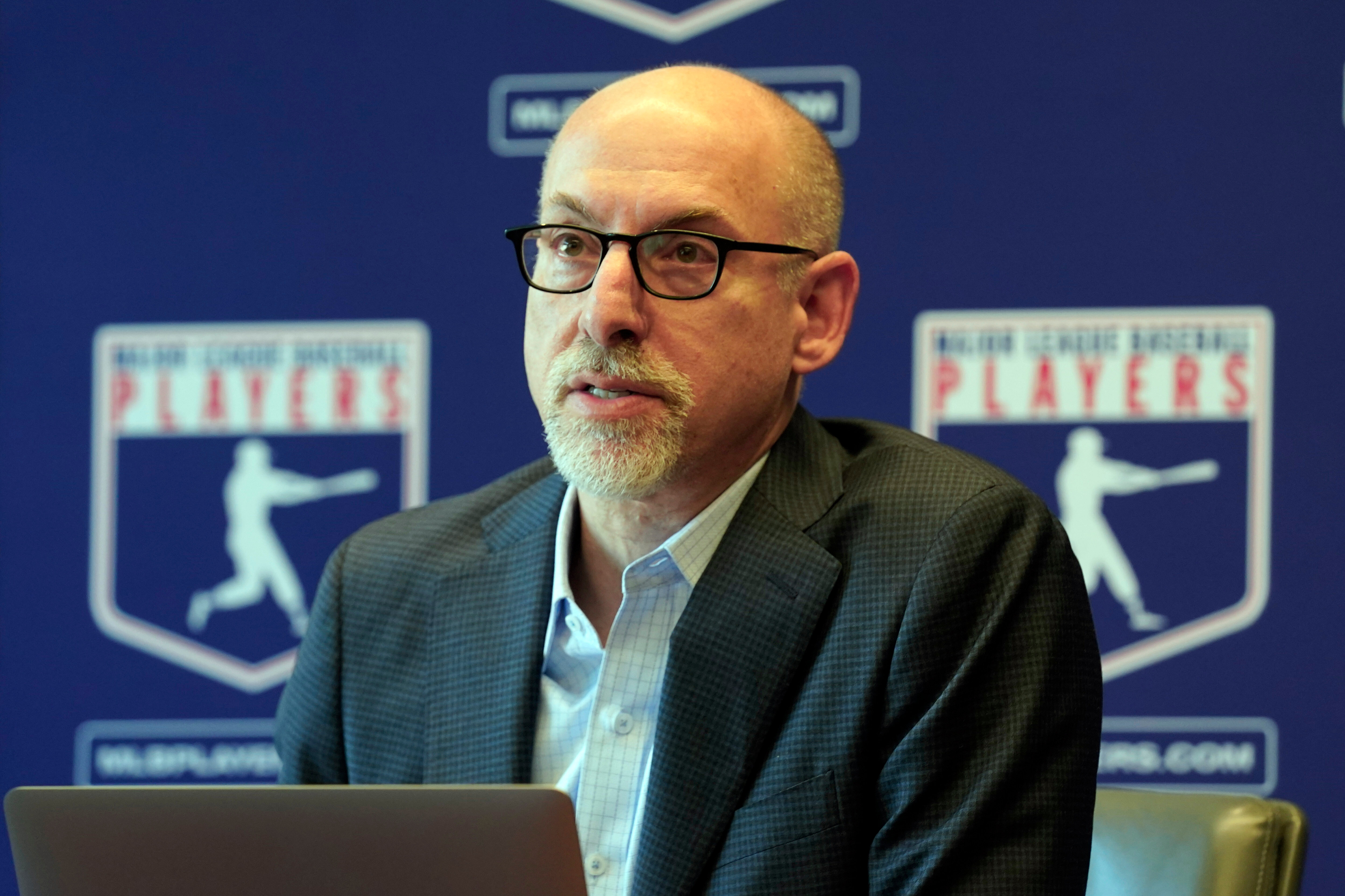 FILE - Major League Baseball Players Association Senior Director, Collective Bargaining & Legal, Bruce Meyer answers a question at a news conference in their offices in New York, March 11, 2022.