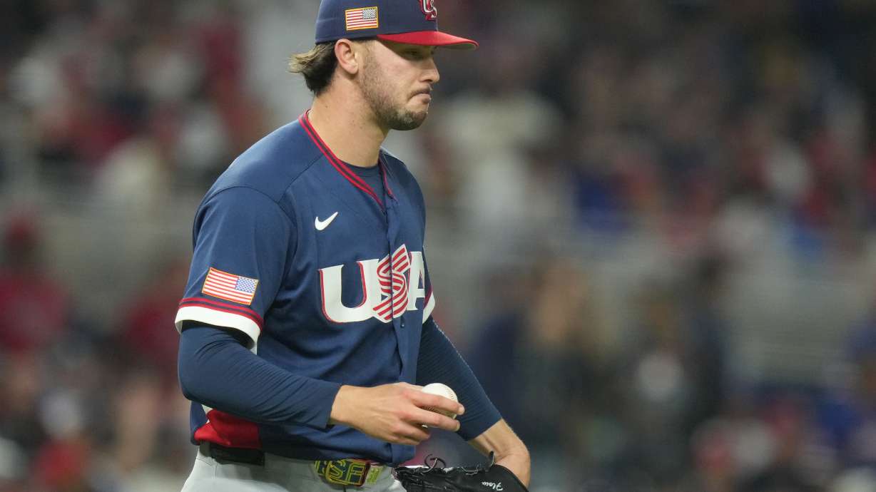 United States pitcher Paul Skenes walks back to the mound during the fourth inning of a World Baseball Classic semifinal game against the Dominican Republic, Sunday, March 15, 2026, in Miami. Skenes flag patch on the hat and sleeve are backwards.
