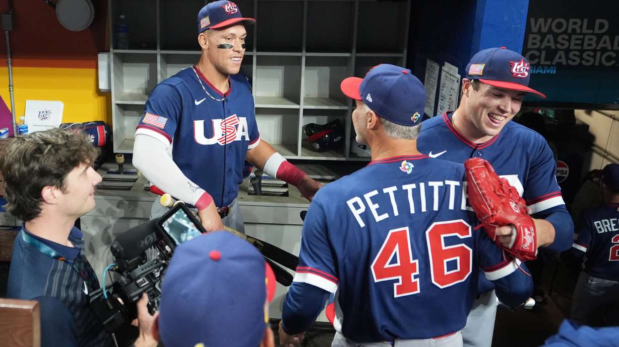 The United States team celebrates after defeating the Dominican Republic at a World Baseball Classic semifinal game, Sunday, March 15, 2026, in Miami.
