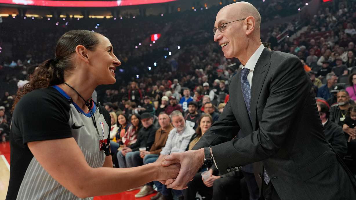 NBA commissioner Adam Silver greets NBA referee Ashley Moyer-Gleich as he arrives for an NBA basketball game between the Portland Trail Blazers and the Utah Jazz, Friday, March 13, 2026, in Portland, Ore.