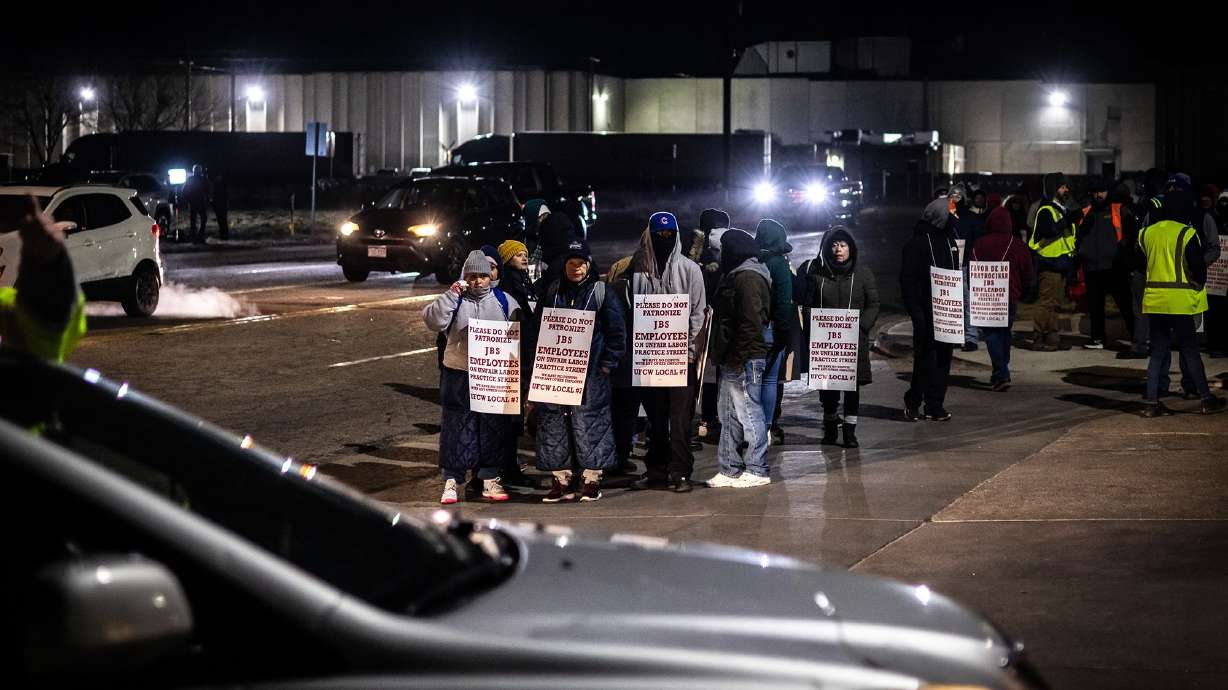 Workers and supporters picket during a strike at the JBS Greeley meatpacking facility in Greeley, Colo., on Monday.